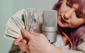 woman with mic holding money