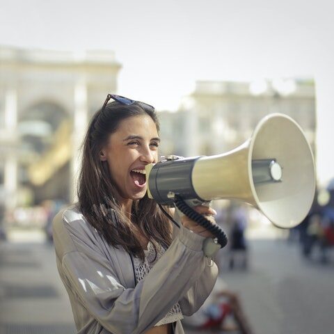 woman using megaphone